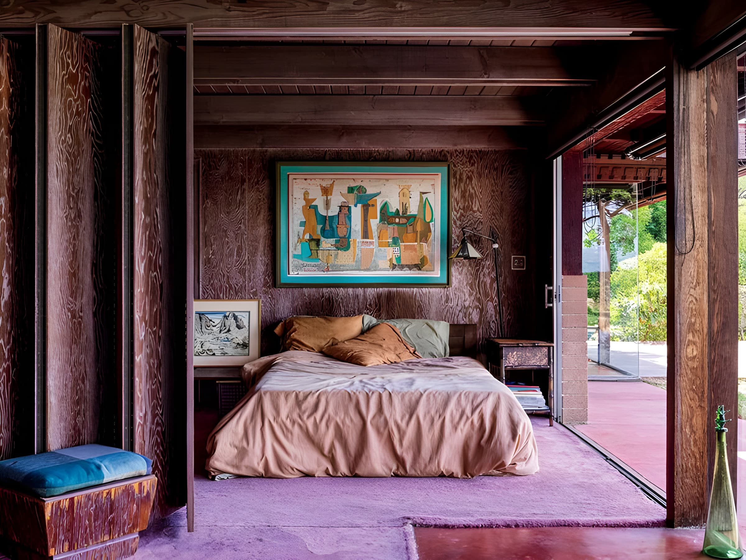 Dark wood bedroom with a pale rose bed