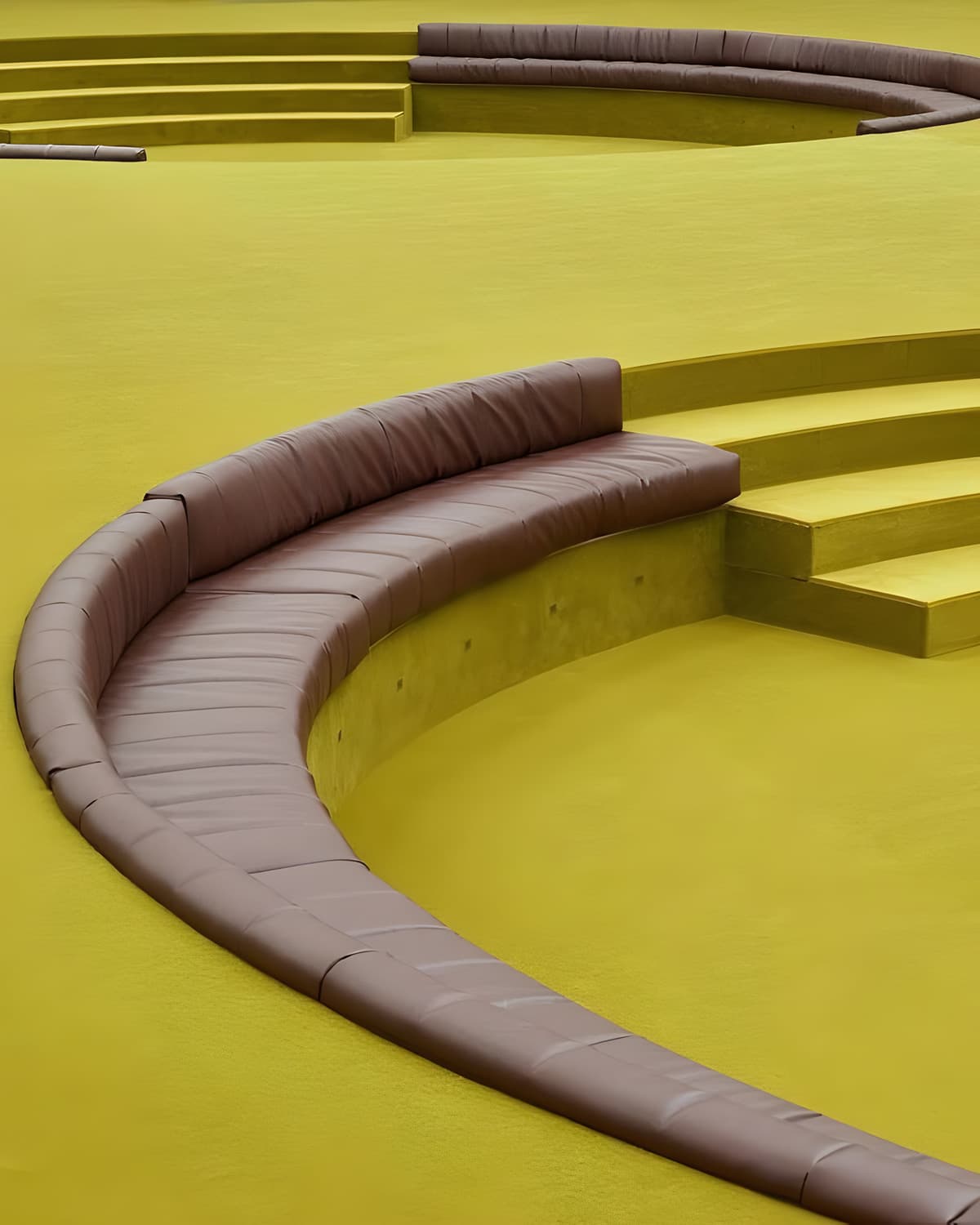 Curved yellow seating in a theatrical room